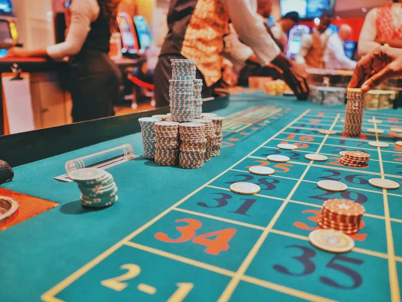 Betting table - high-stakes decision making - Photo by Kay / Unsplash